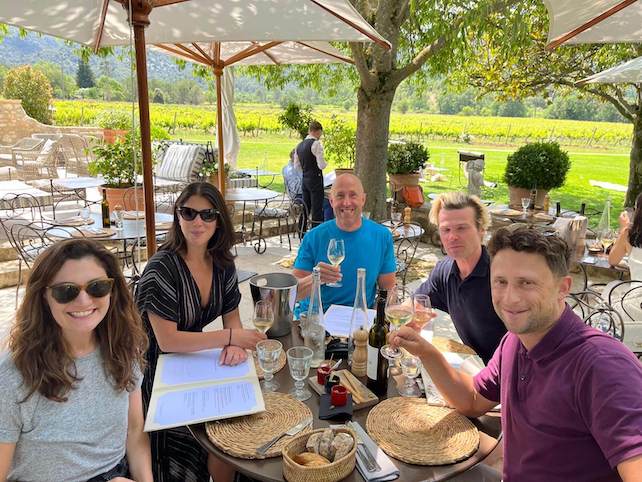 Friends and travelers sharing rosé wine in Provence for a convivial moment